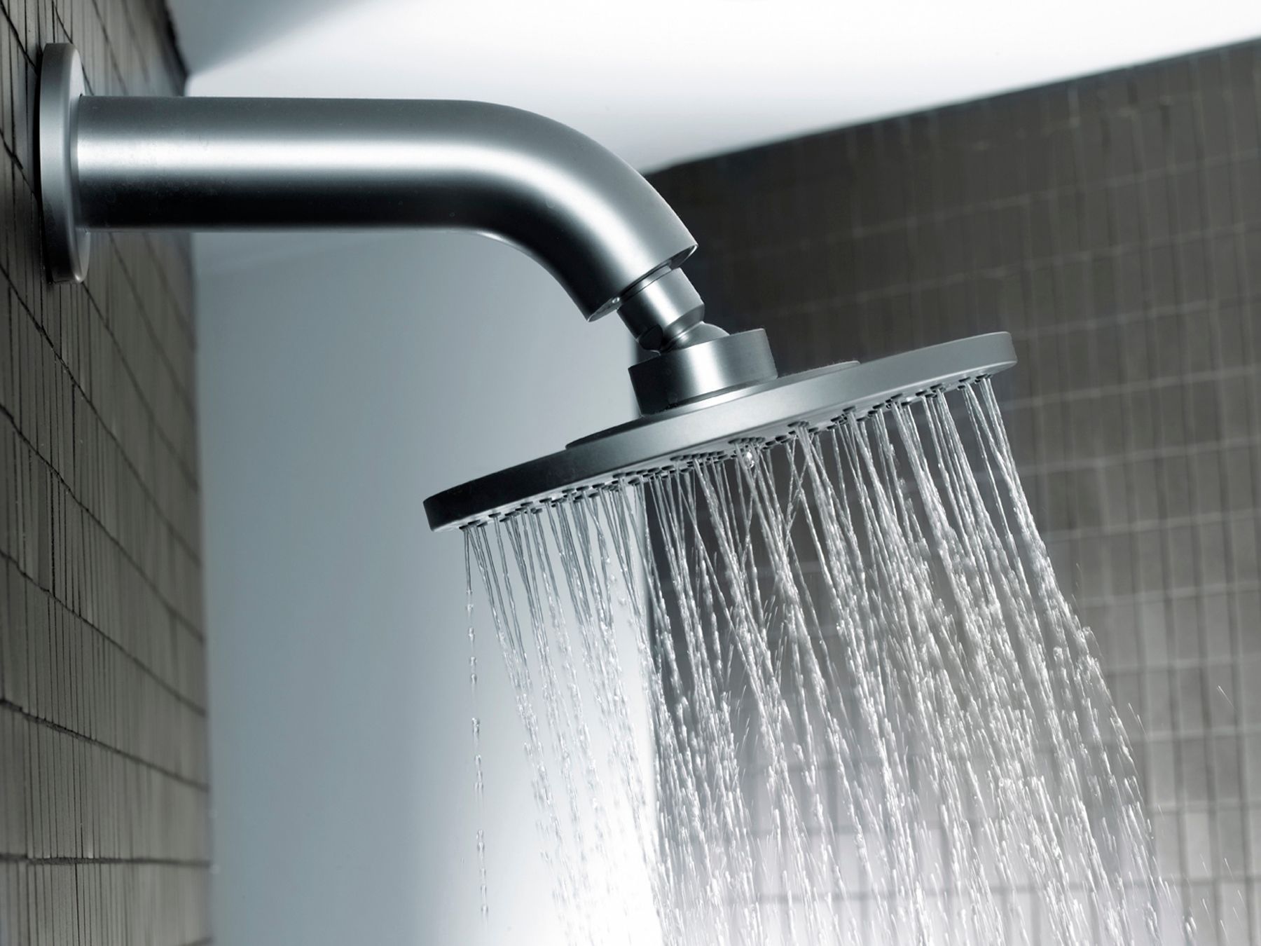 A shower head with water coming out of it