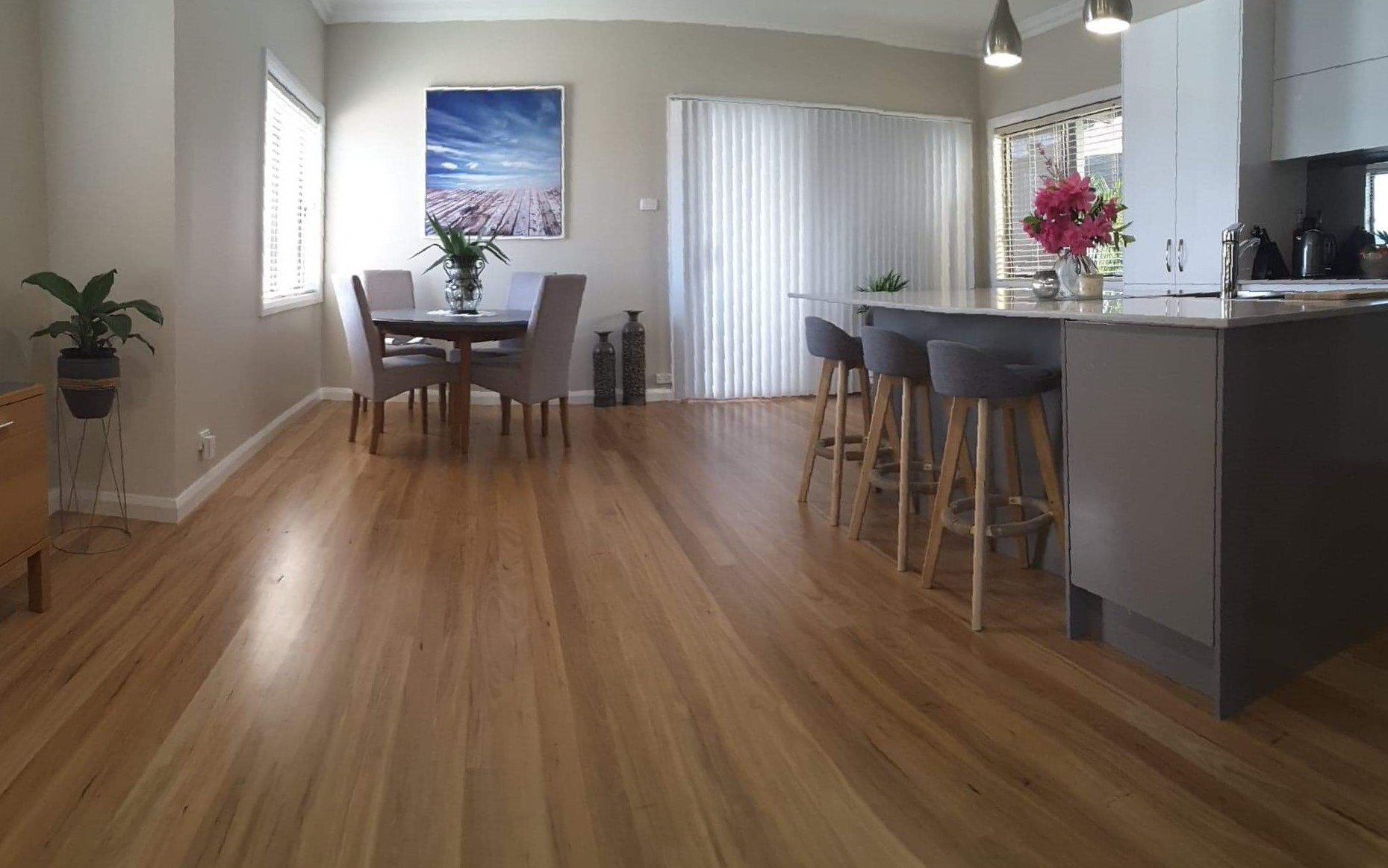 Worker Measuring Timber Floor — WJM Timber Floors In Newcastle, NSW Worker Measuring Timber Floor — WJM Timber Floors In Newcastle, NSW