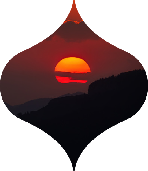Red sunset over dark hills, framed in a diamond-shaped silhouette.