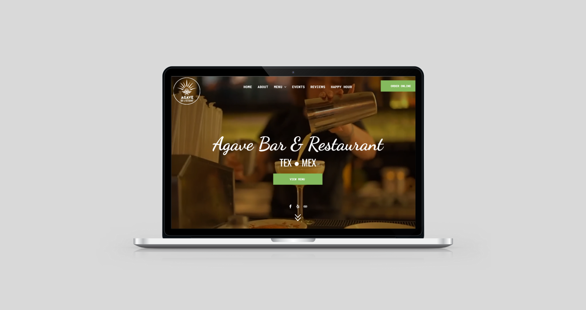 Laptop displaying the Agave Bar & Restaurant website, with a bartender pouring a drink.