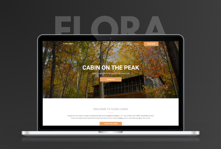 A laptop computer is displaying a website for a cabin on the peak.