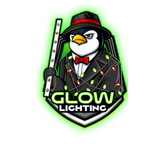 A penguin in a suit and tie is holding a glowing stick.