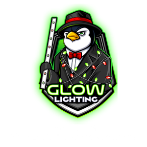 A penguin in a suit and tie is holding a glowing stick.