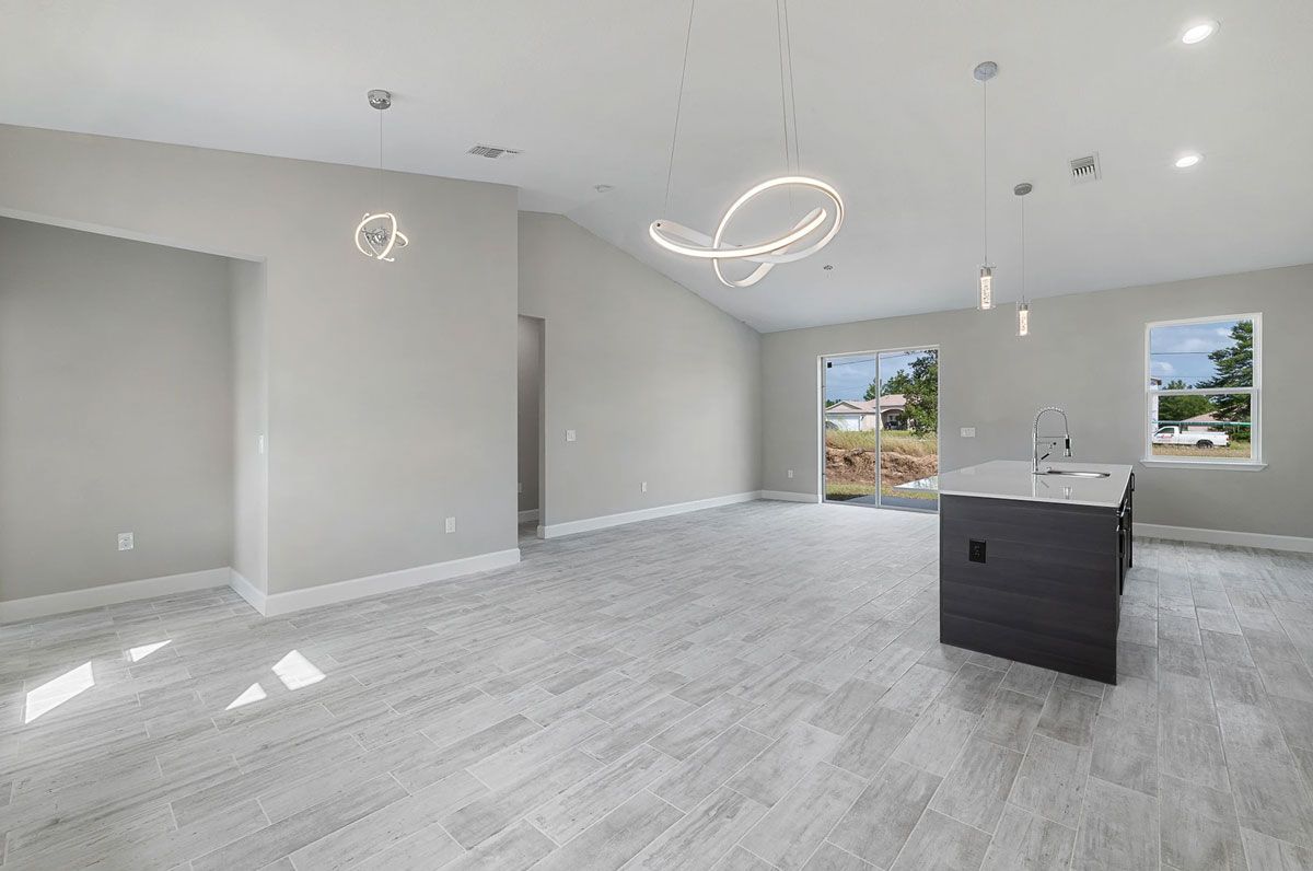 There is a kitchen in the middle of the room.