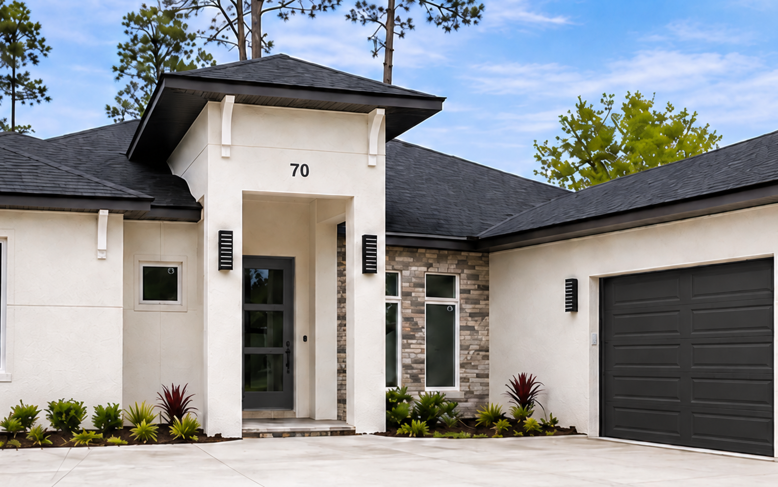Modern white house exterior with a front entry and brown garage door