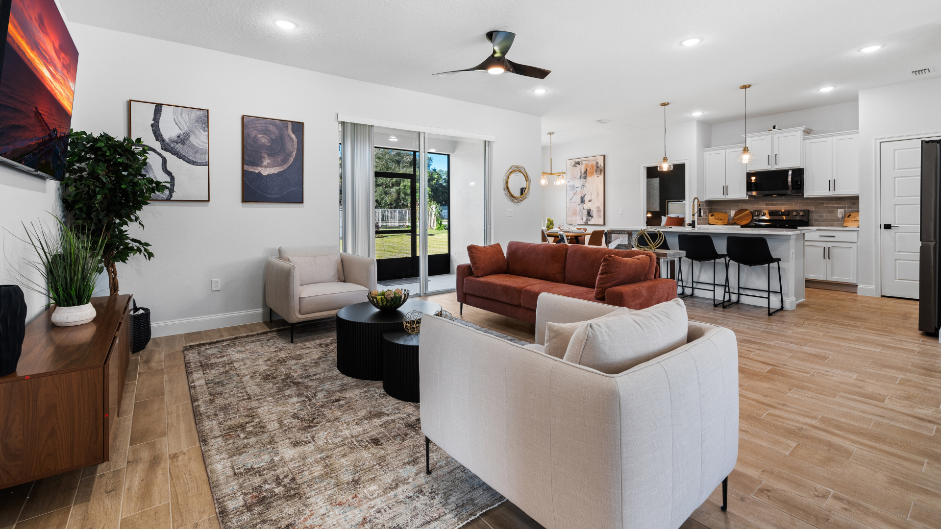 Spacious Caspian Homes Grand Alborz home  interior with open floor plan, modern kitchen flowing into living room, natural lighting, and warm, lived-in design, showcasing contemporary residential style.