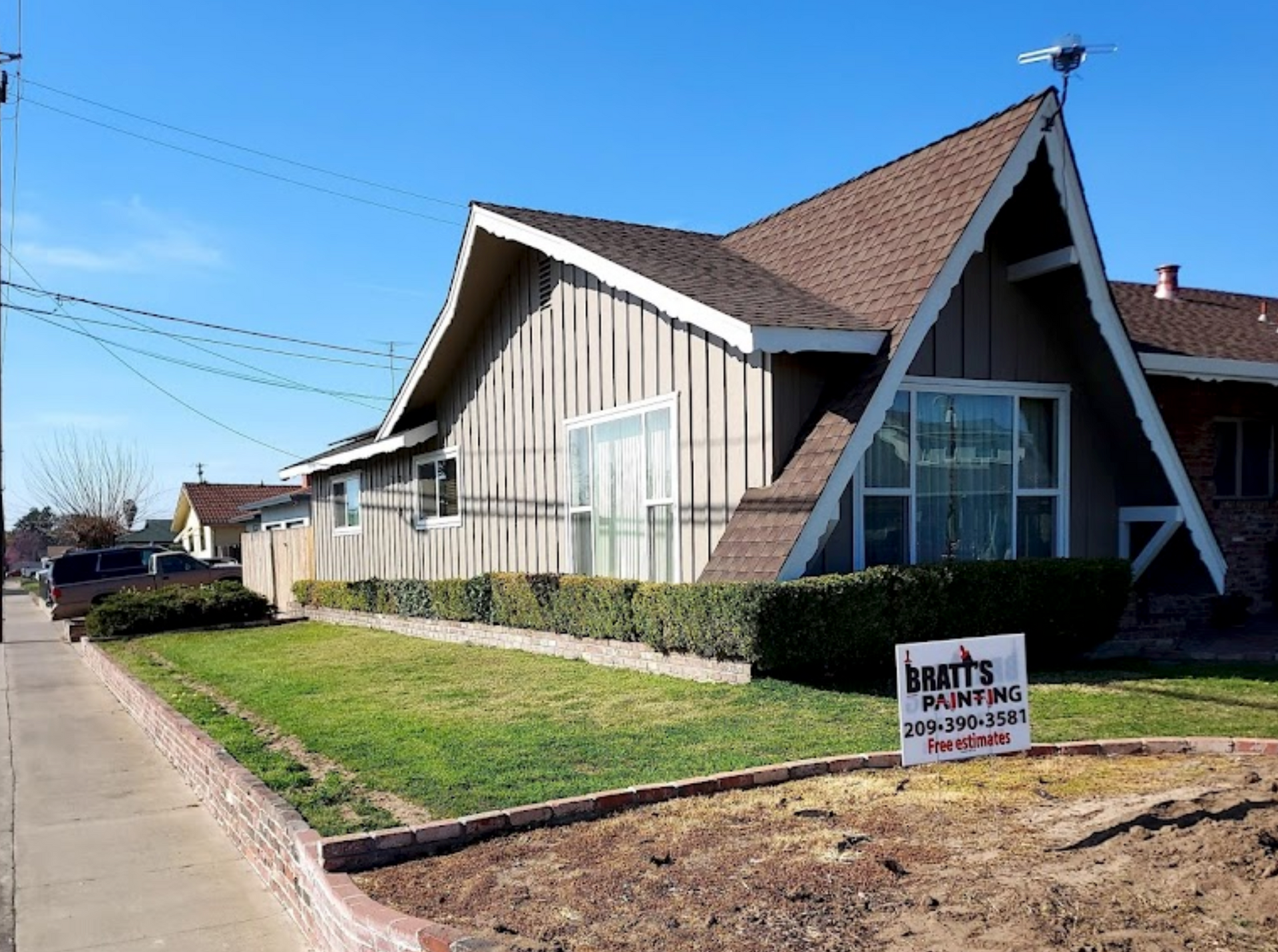 Professional exterior house painting in progress by Bratts Painting in Manteca.