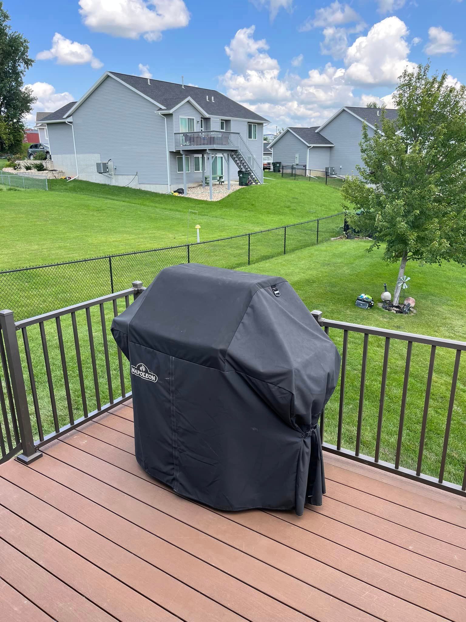 two sack of mulches are sitting on top of a lush green lawn