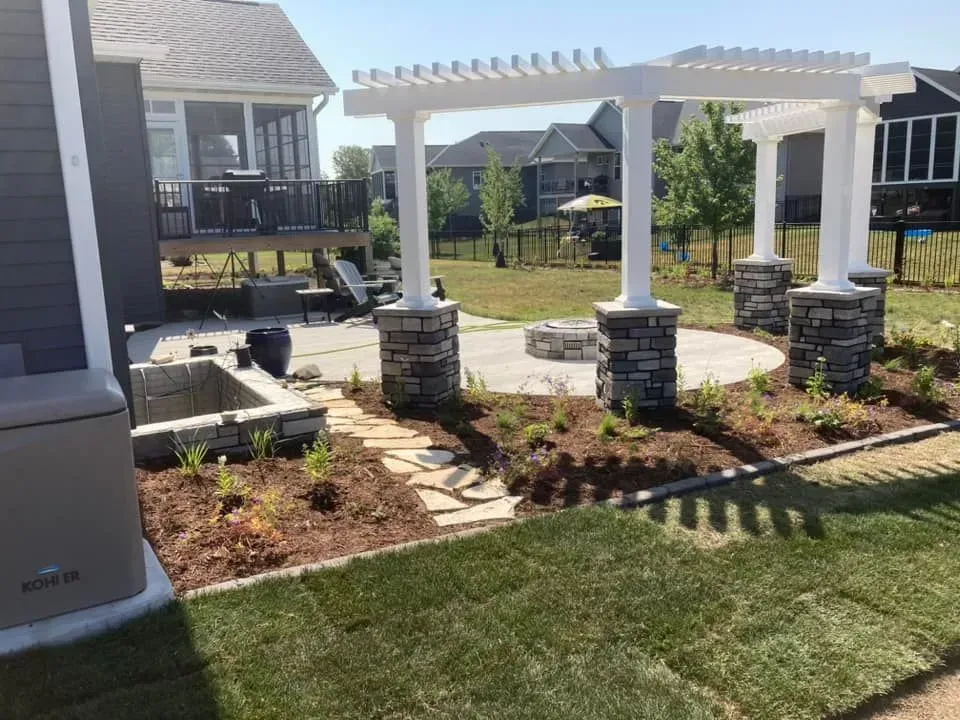 there is a pergola in the backyard of a house