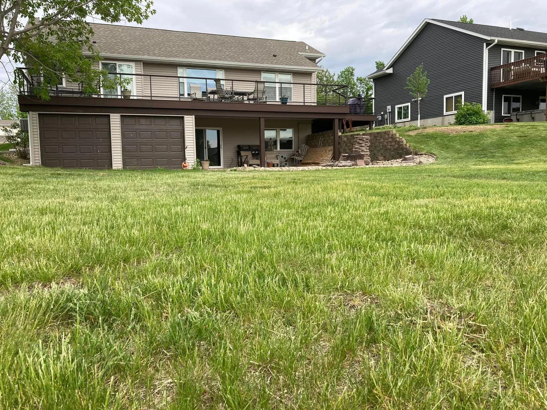 a large house with a large grassy field in front of it