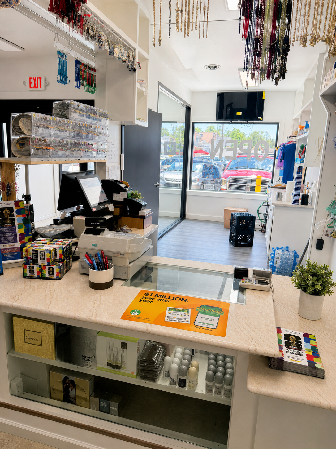 Bright retail checkout counter with candy, display shelves, and sunlight through the front window