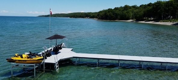 An image of a pipe dock overlooking the blue waters of lake huron.