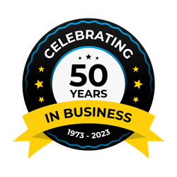 A black and white circle with a yellow ribbon that says celebrating 50 years in business.