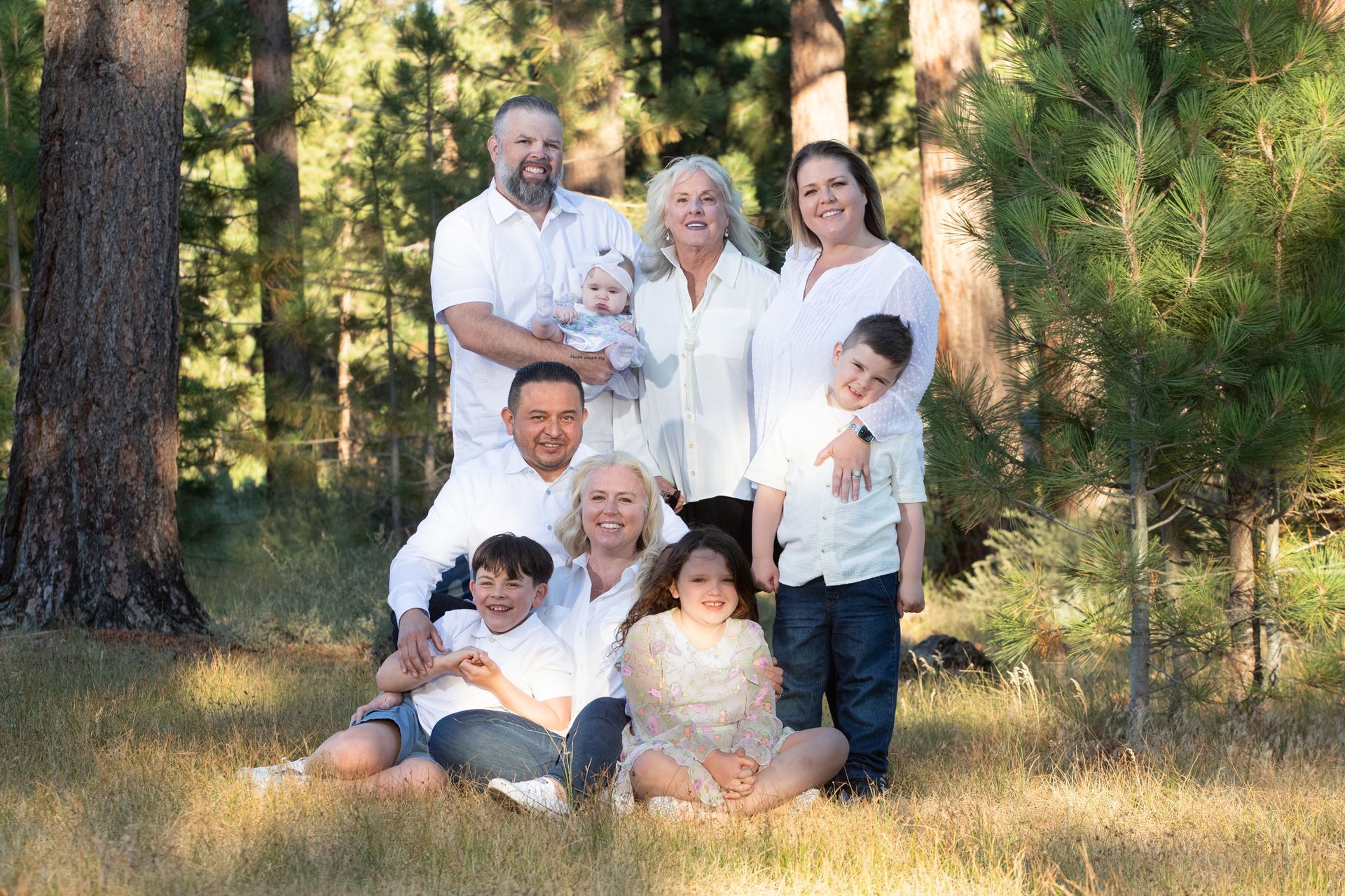 Candid moment of family laughing with grandma on the rocks by South Lake Tahoe
