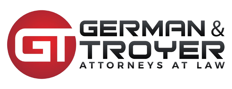 A logo for german & troyer attorneys at law