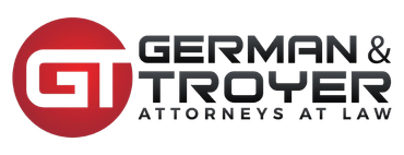 A logo for german & troyer attorneys at law