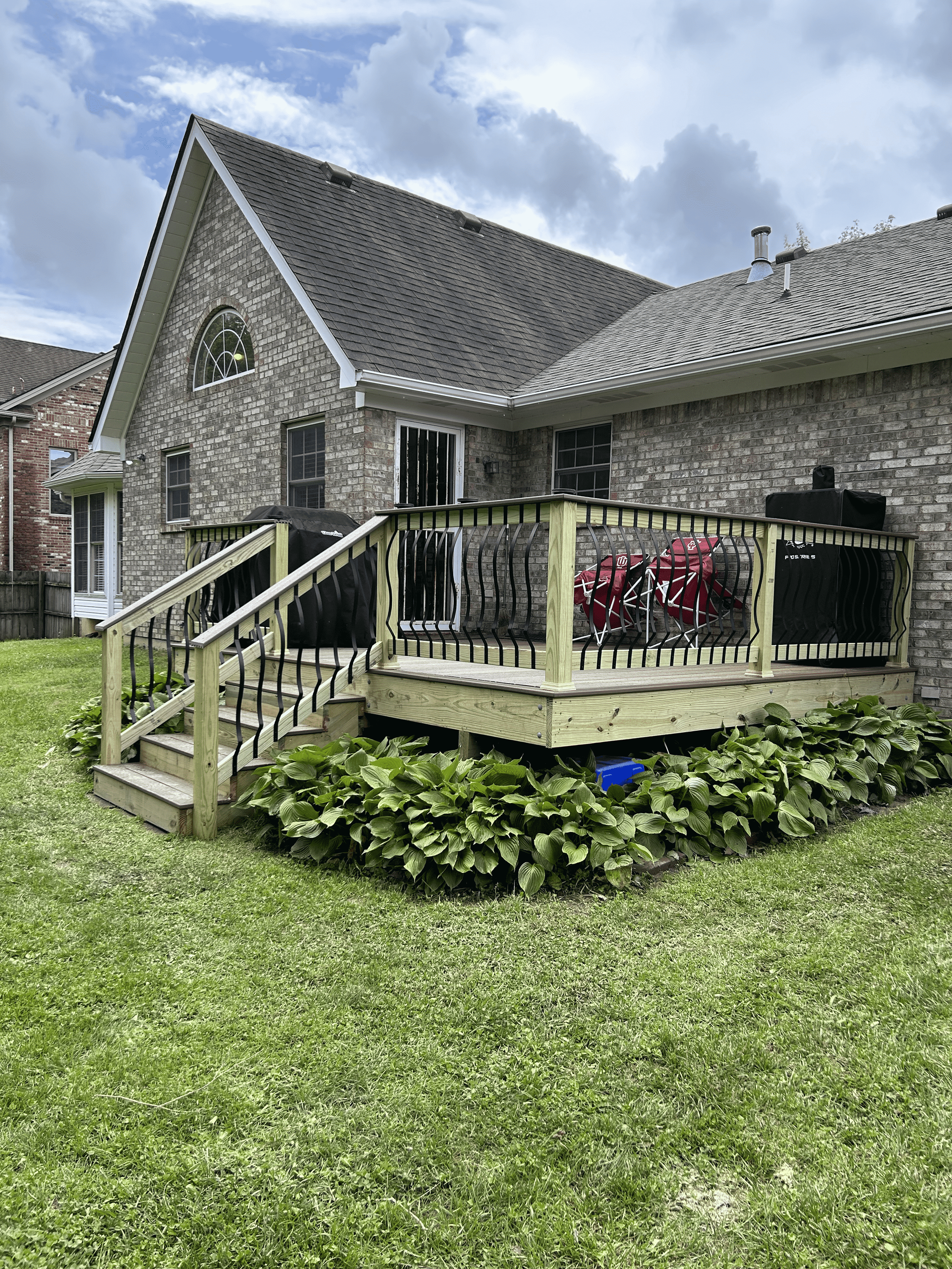 Backyard deck installation in Pendleton – DeckHeadSky custom wood deck with decorative railing and built-in stairs