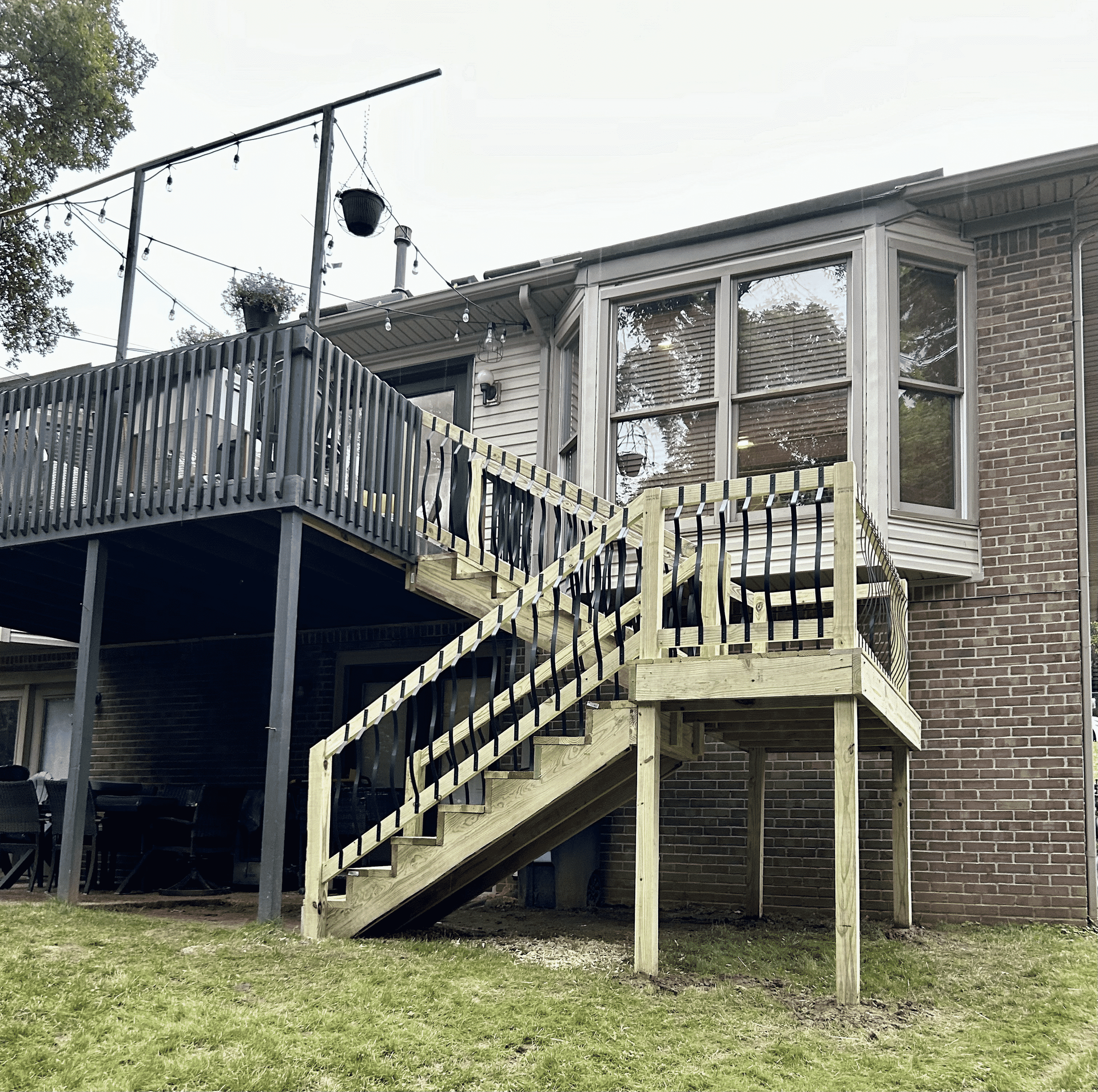 Deck stair installation in Pendleton – DeckHeadSky elevated deck with custom wood stairs and decorative railing