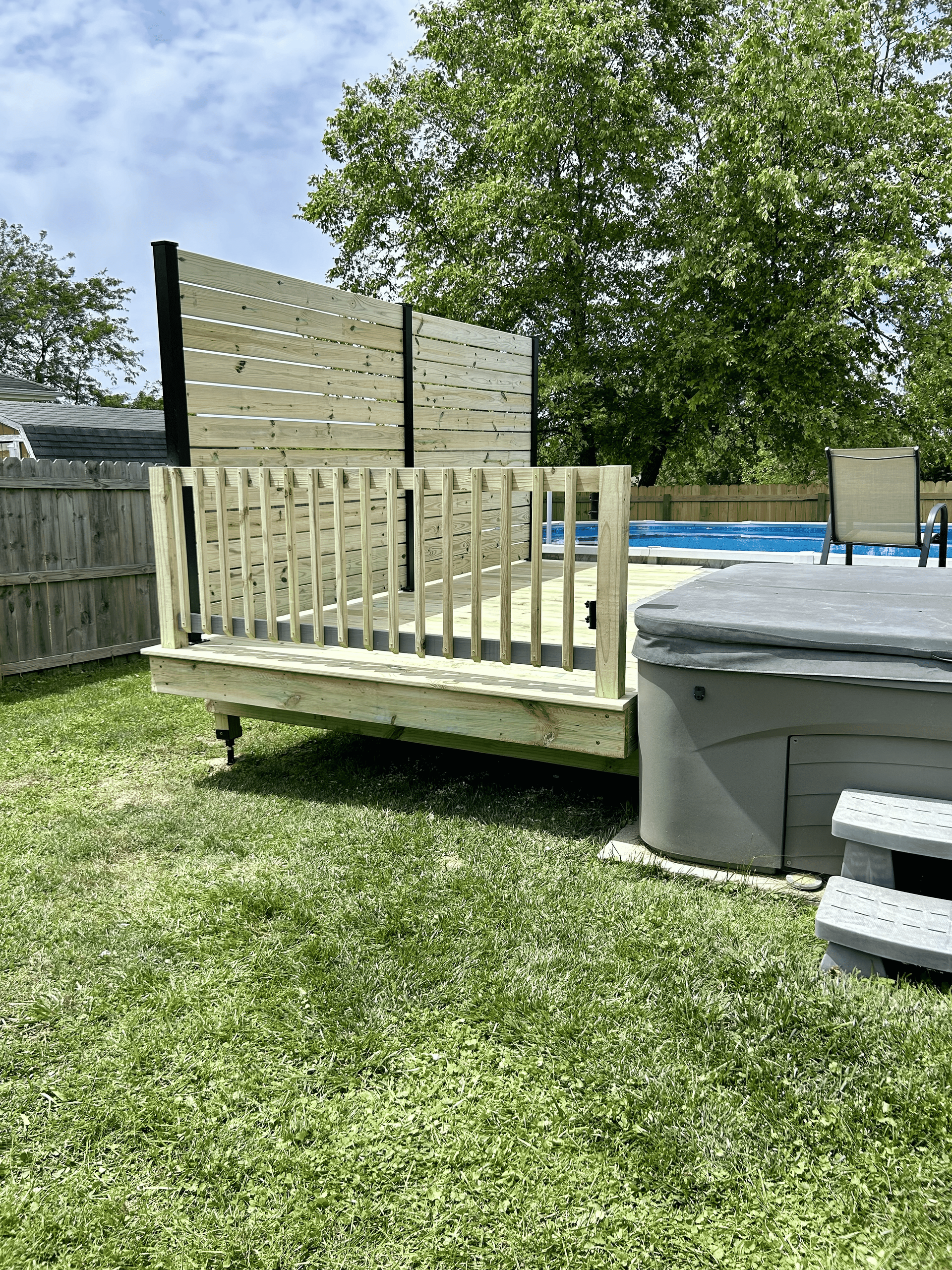 Poolside deck installation in Pendleton – DeckHeadSky custom wood deck with privacy wall and railing for backyard relaxation