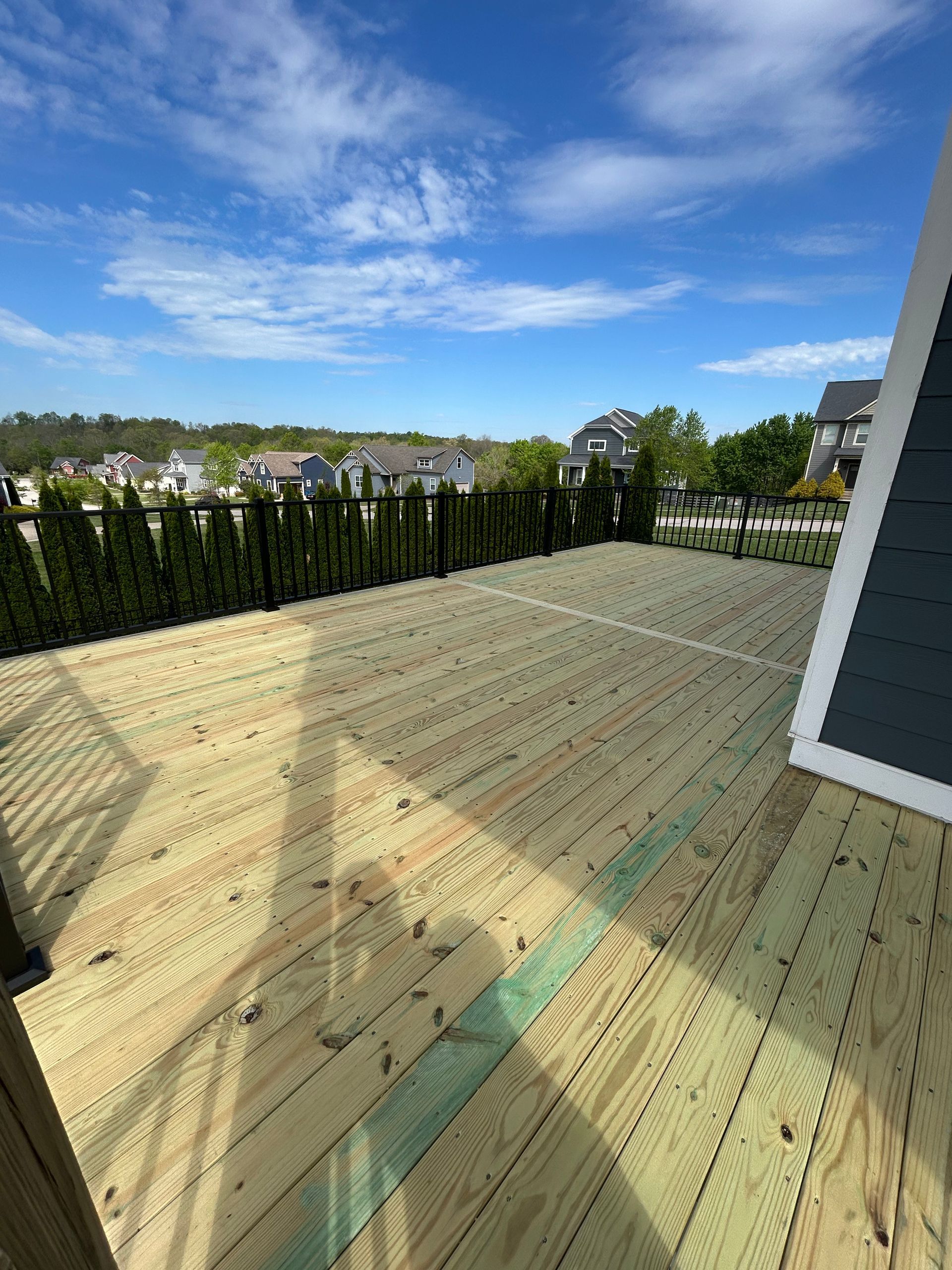 Multi-level wooden decks with custom seating areas.