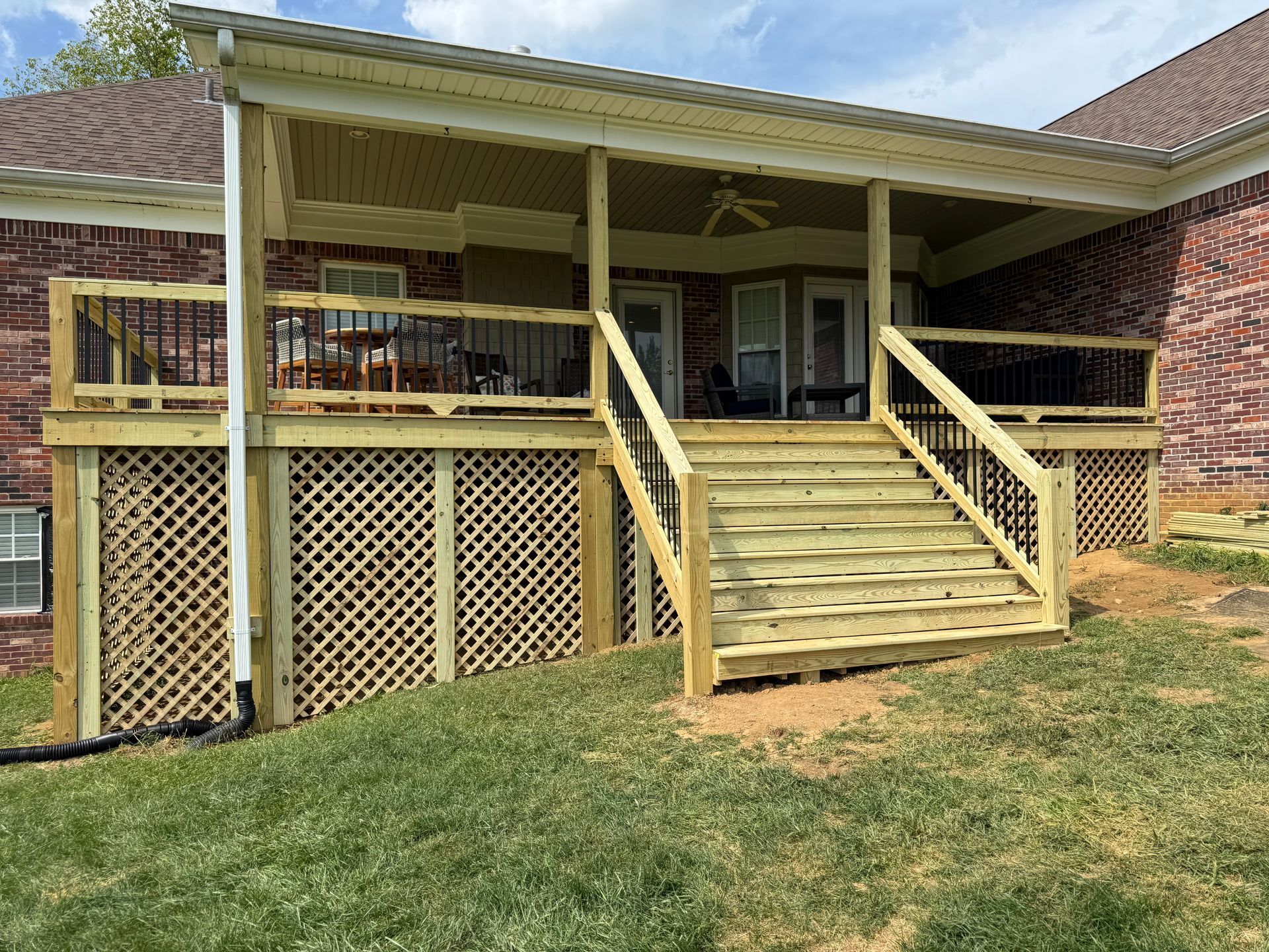 Backyard deck renovation in Pendleton – DeckHeadSky upgraded wood deck with decorative railing and built-in stairs
