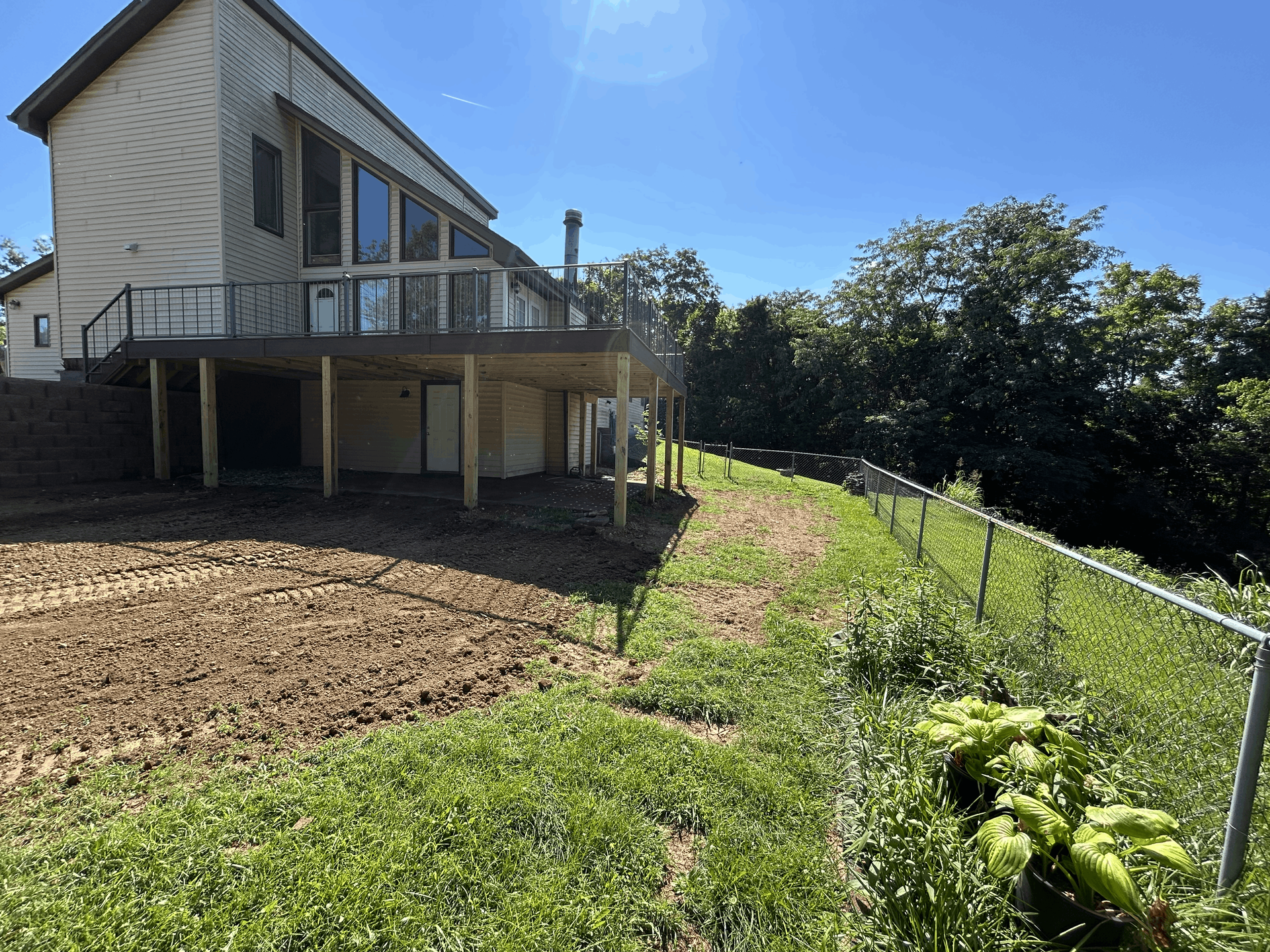 Multi-level wooden decks with custom seating areas.