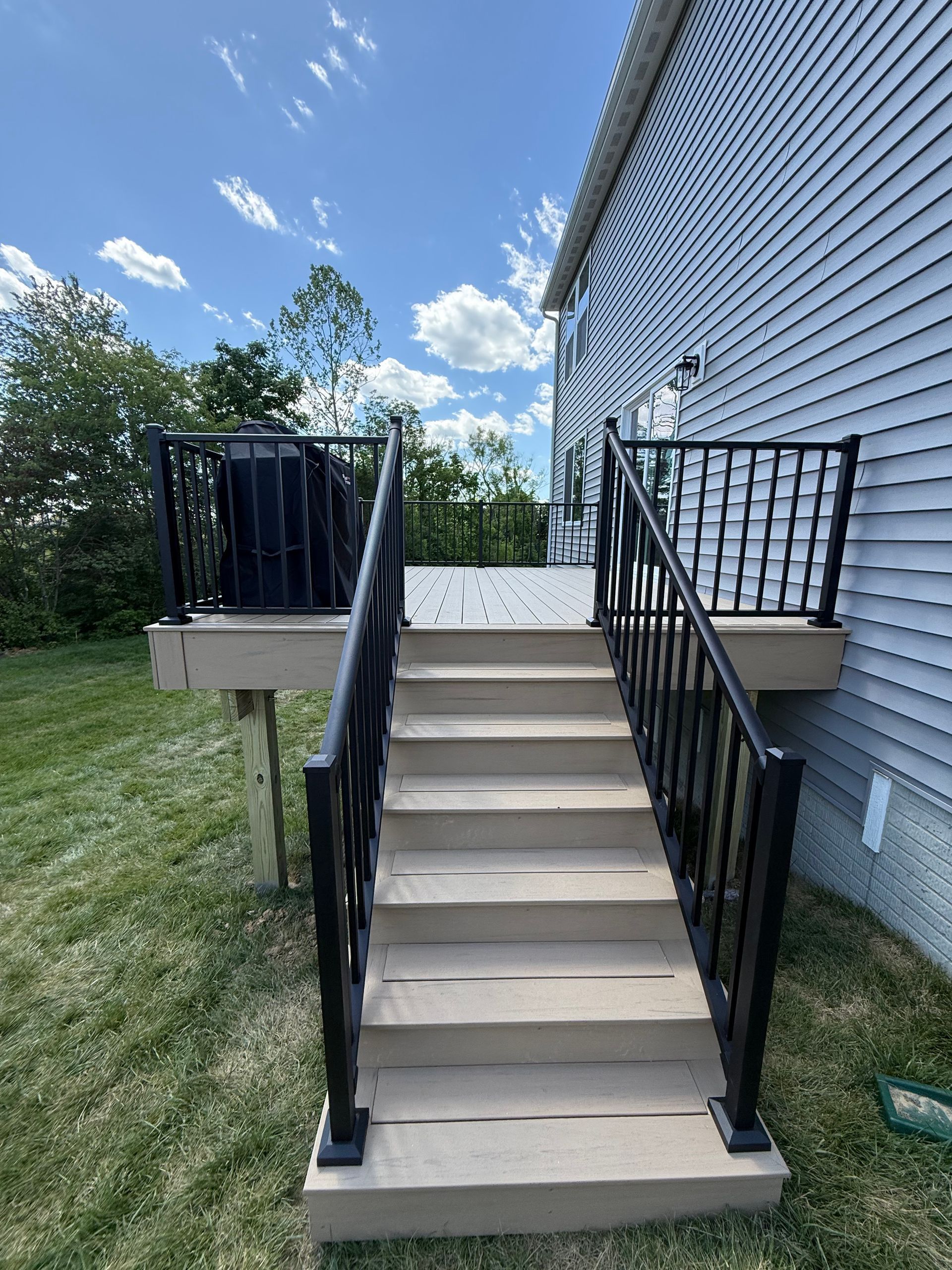 Deck contractor project with strong wood framing and secure railing in LaGrange