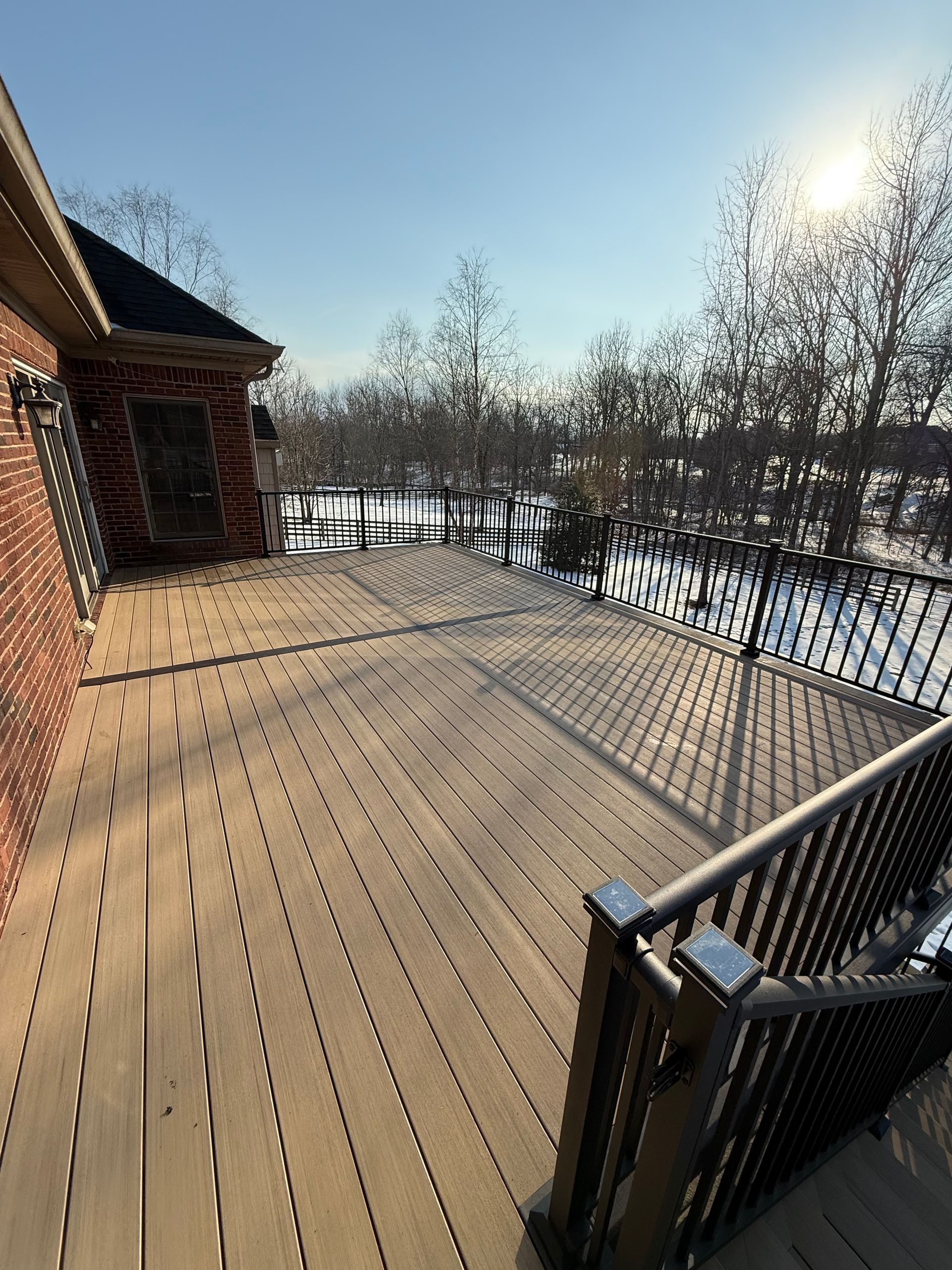 Multi-level wood deck with custom seating in Oldham County
