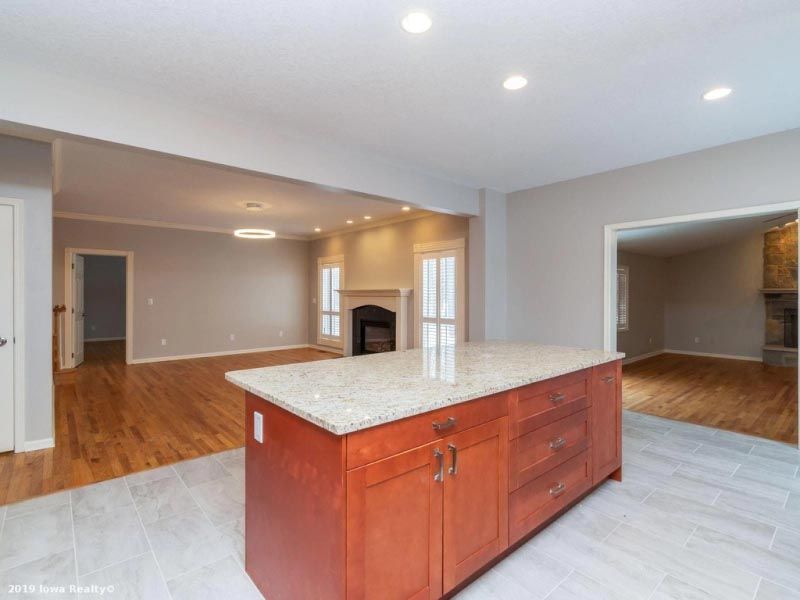 There is a large island in the middle of the kitchen.
