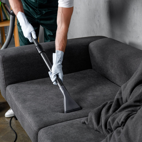 Man Cleaning Sofa - Greenville, NC - Jansen Upholstery & Carpet Cleaning Man Cleaning Sofa - Greenville, NC - Jansen Upholstery & Carpet Cleaning