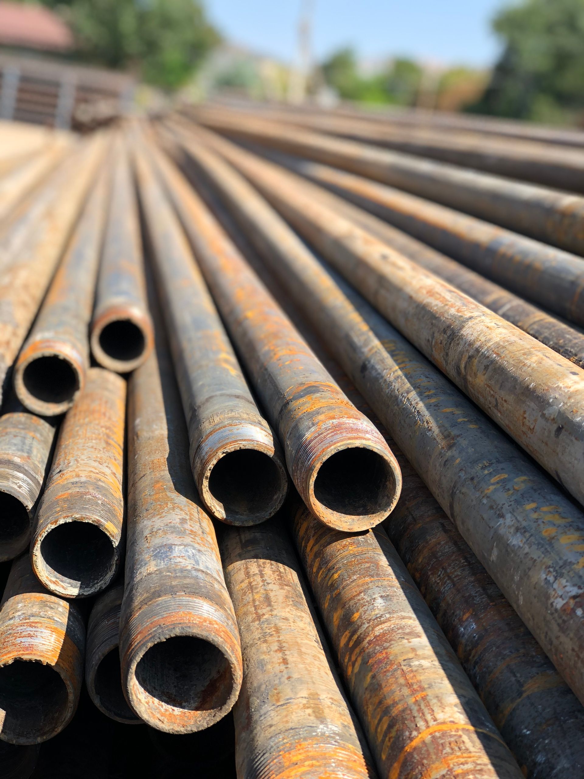Long iron piled up at a scrap yard.