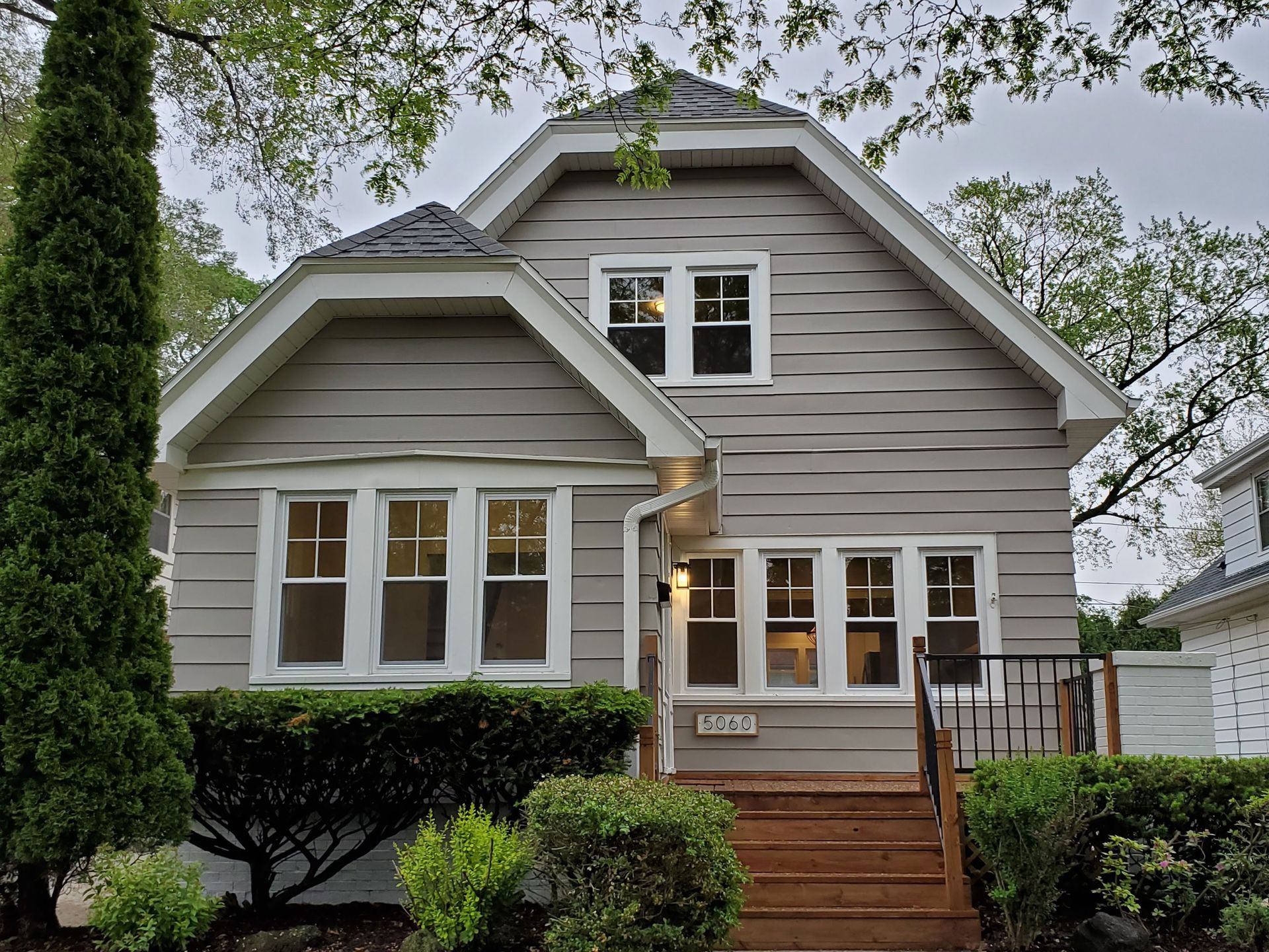a house with a lot of windows is for sale