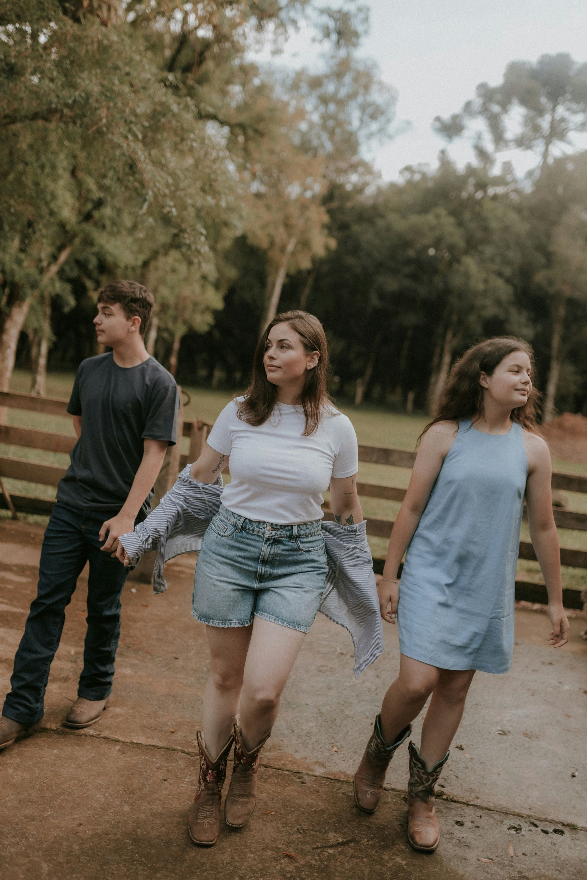Three siblings walking apart, representing sibling rivalry and the family scapegoat role.