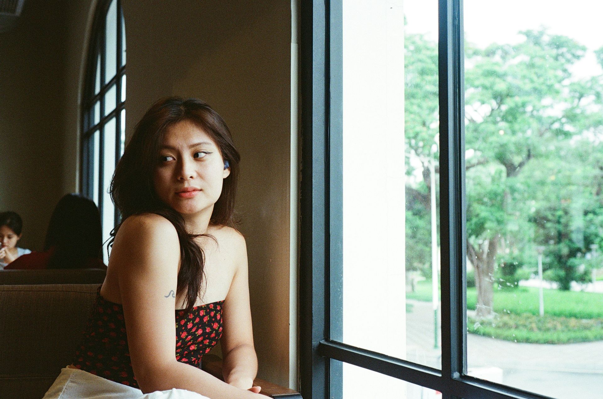 Young woman with a tense expression, reflecting the watchfulness often connected to fawning