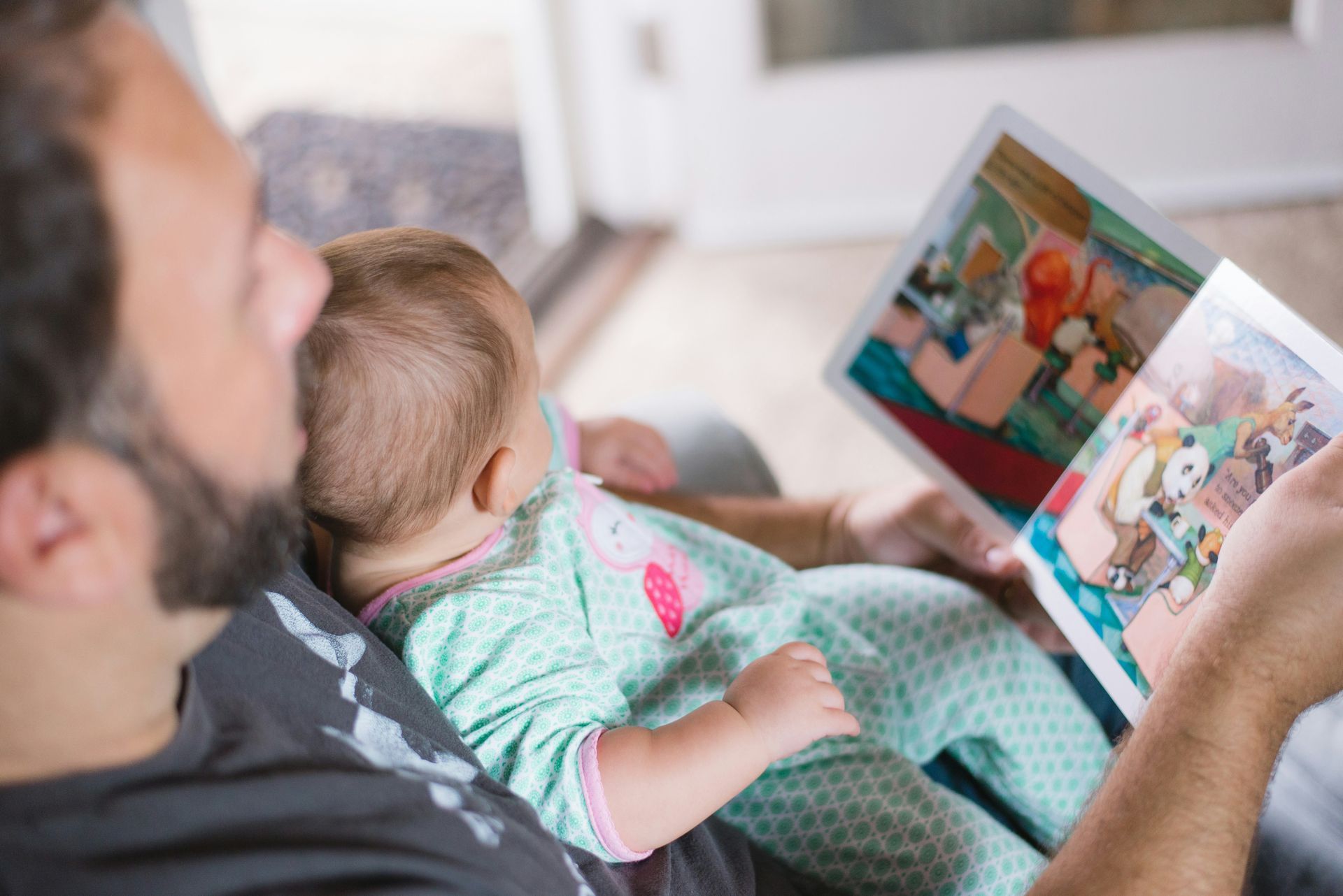 Parent reading a story to their child before bed.