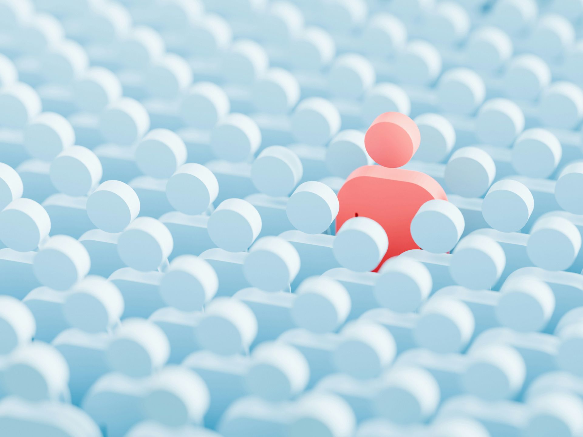 One red figure, in a sea of blue figures, symbolizes being chosen as the scapegoat within a family system.