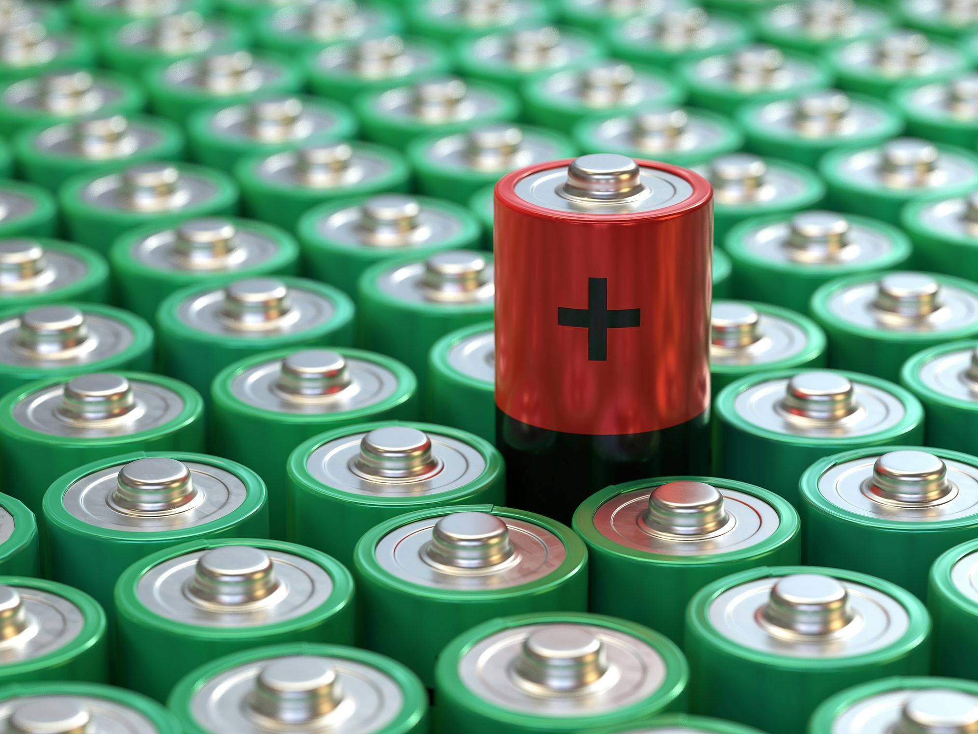 Image of batteries with one battery on top of them all showing the positive end