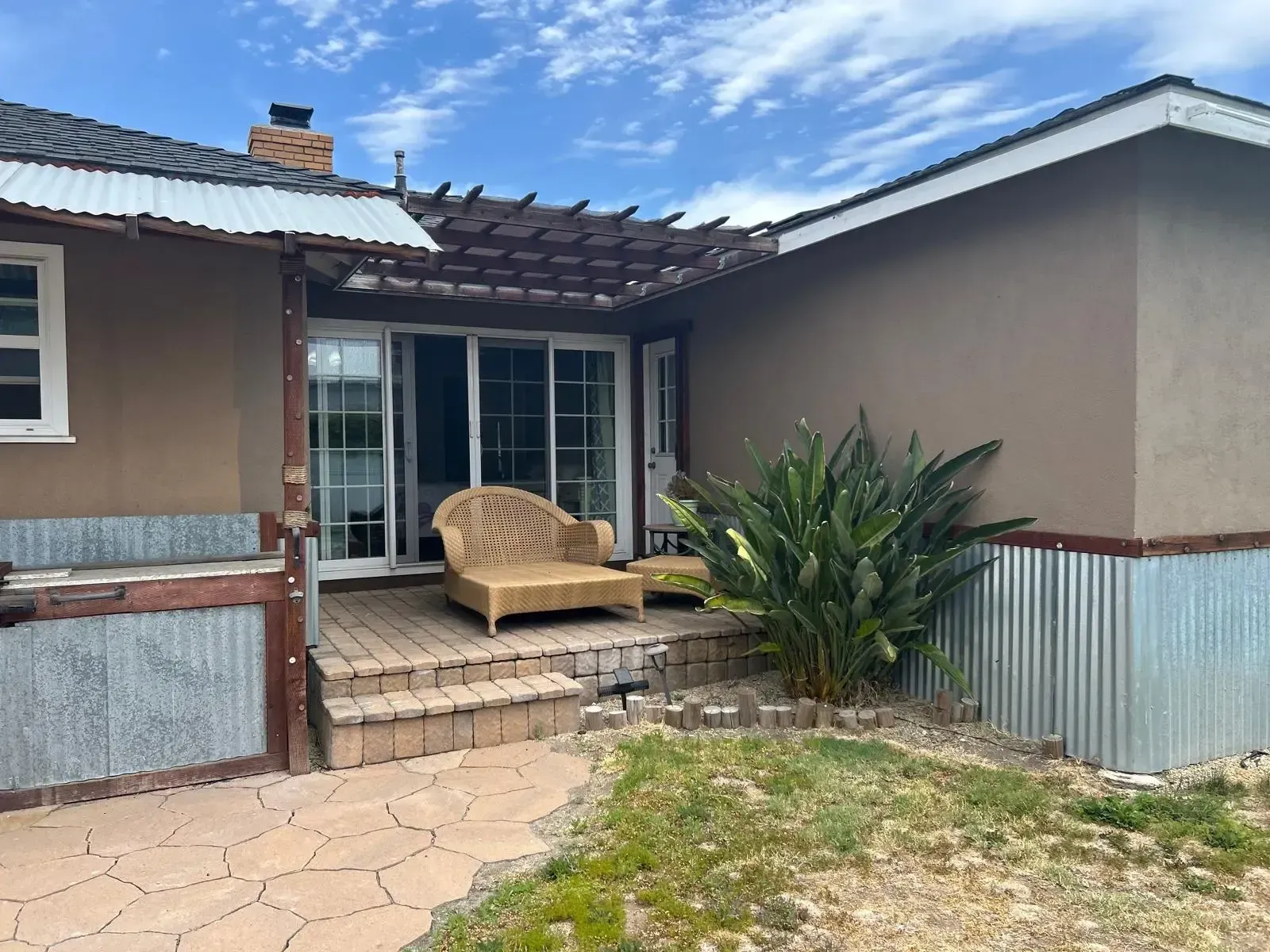 A house with a patio and a chair on it