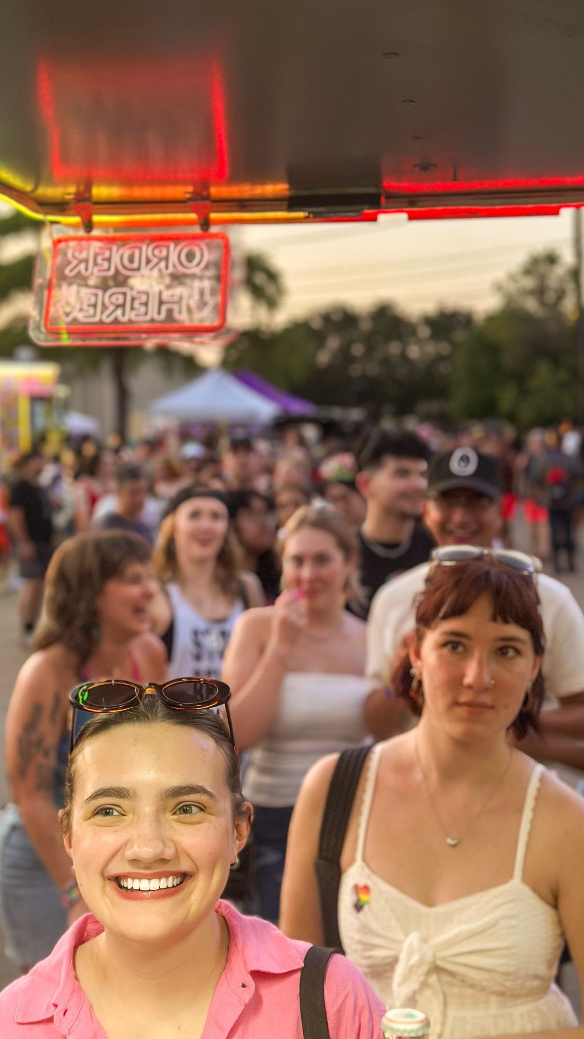 A large crowd of attendees waiting in line for The Mexicans Food Truck during Arlington Pride.