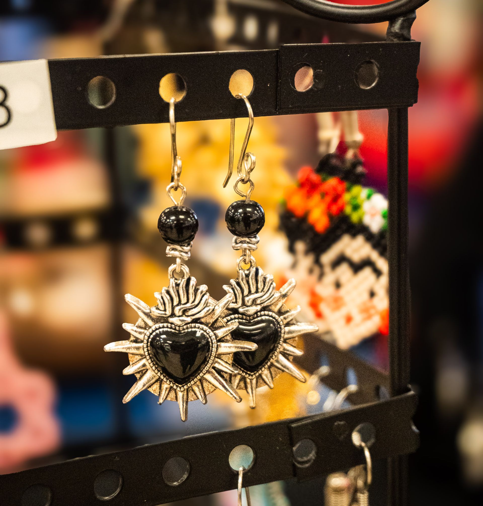 Handcrafted artisan sun earrings available at My Silver Linings during the Tamal & Atole Festival in Fort Worth.
