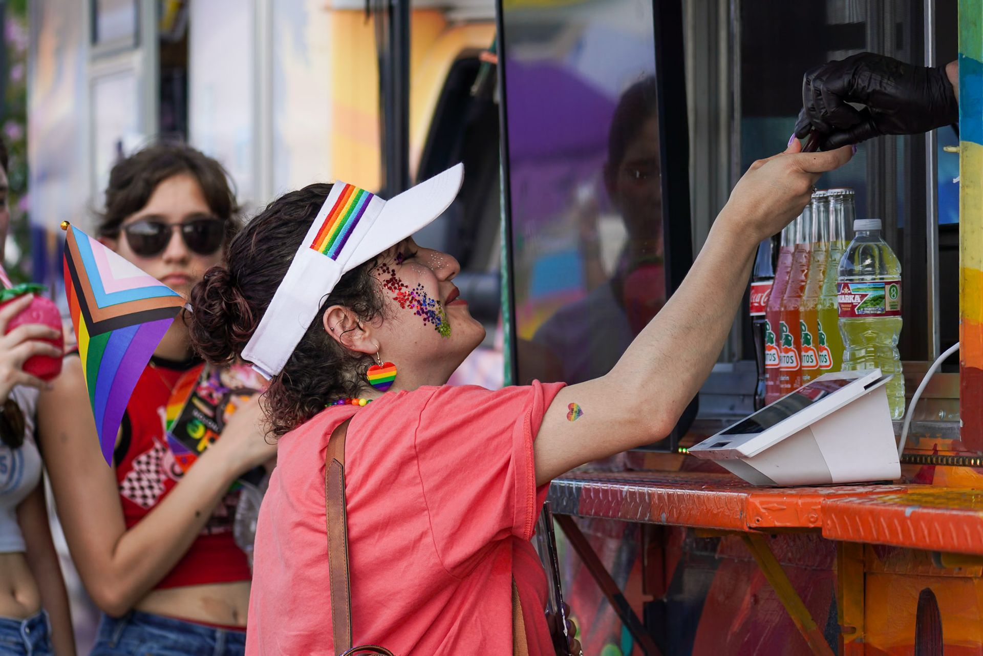 An attendee ordering from The Mexicans Food Truck during the Dallas Pride Festival.