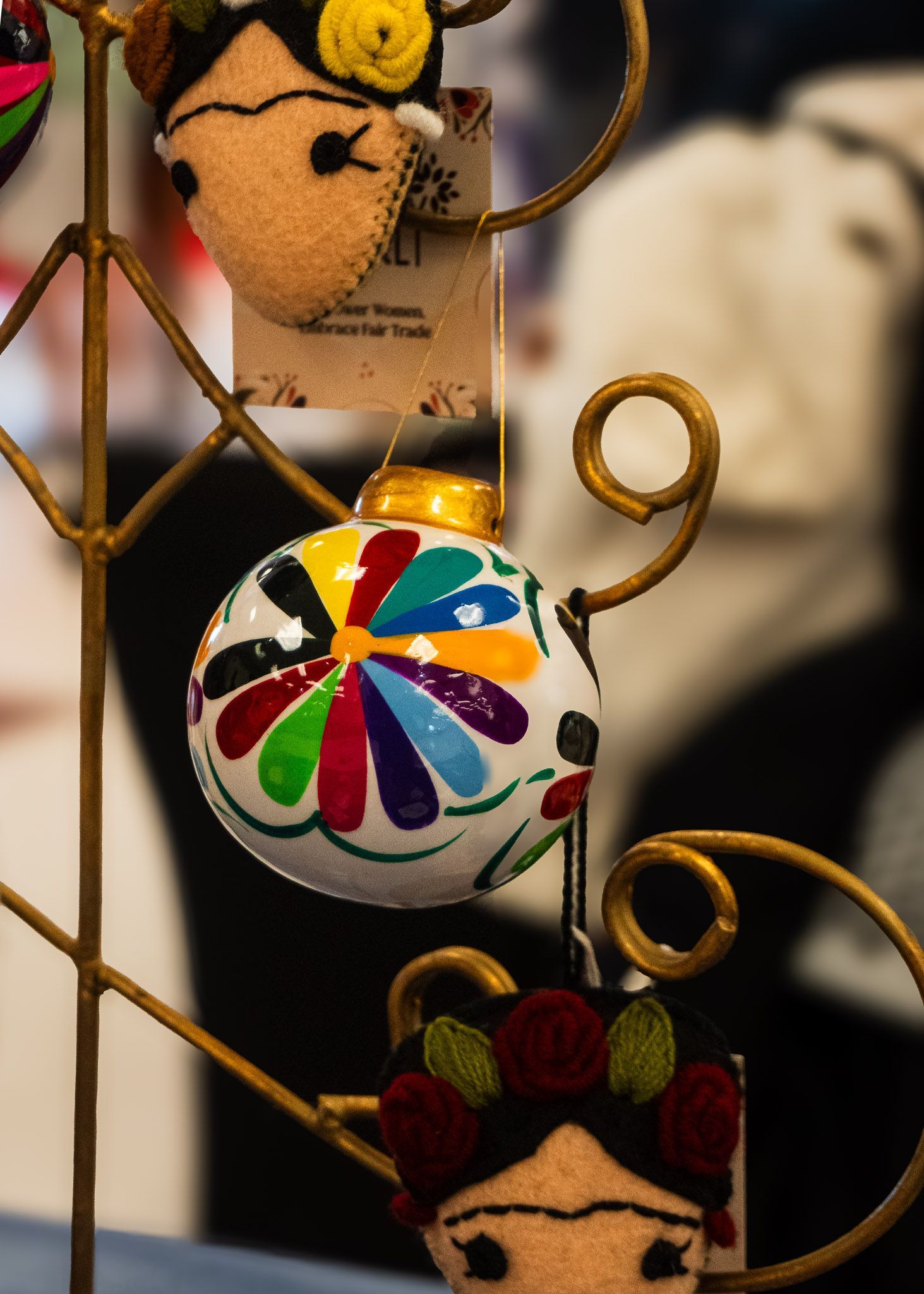Hand-painted artisan holiday ornament displayed by My Silver Linings during the Tamal & Atole Festival in Fort Worth.