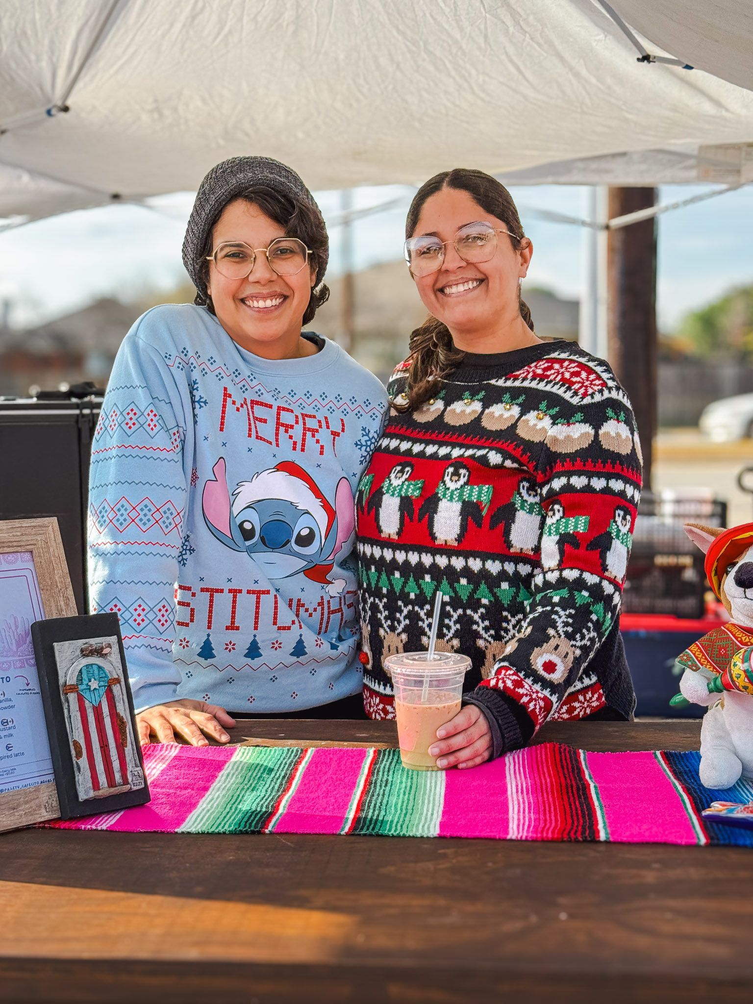 Owners of Pa'Lety serving specialty Puerto Rican coffee during Chinchorreando en Navidad in Fort Worth, Texas.