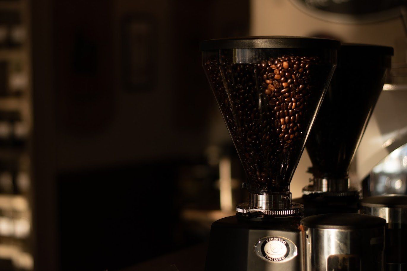 A close-up of a coffee grinder on a counter.