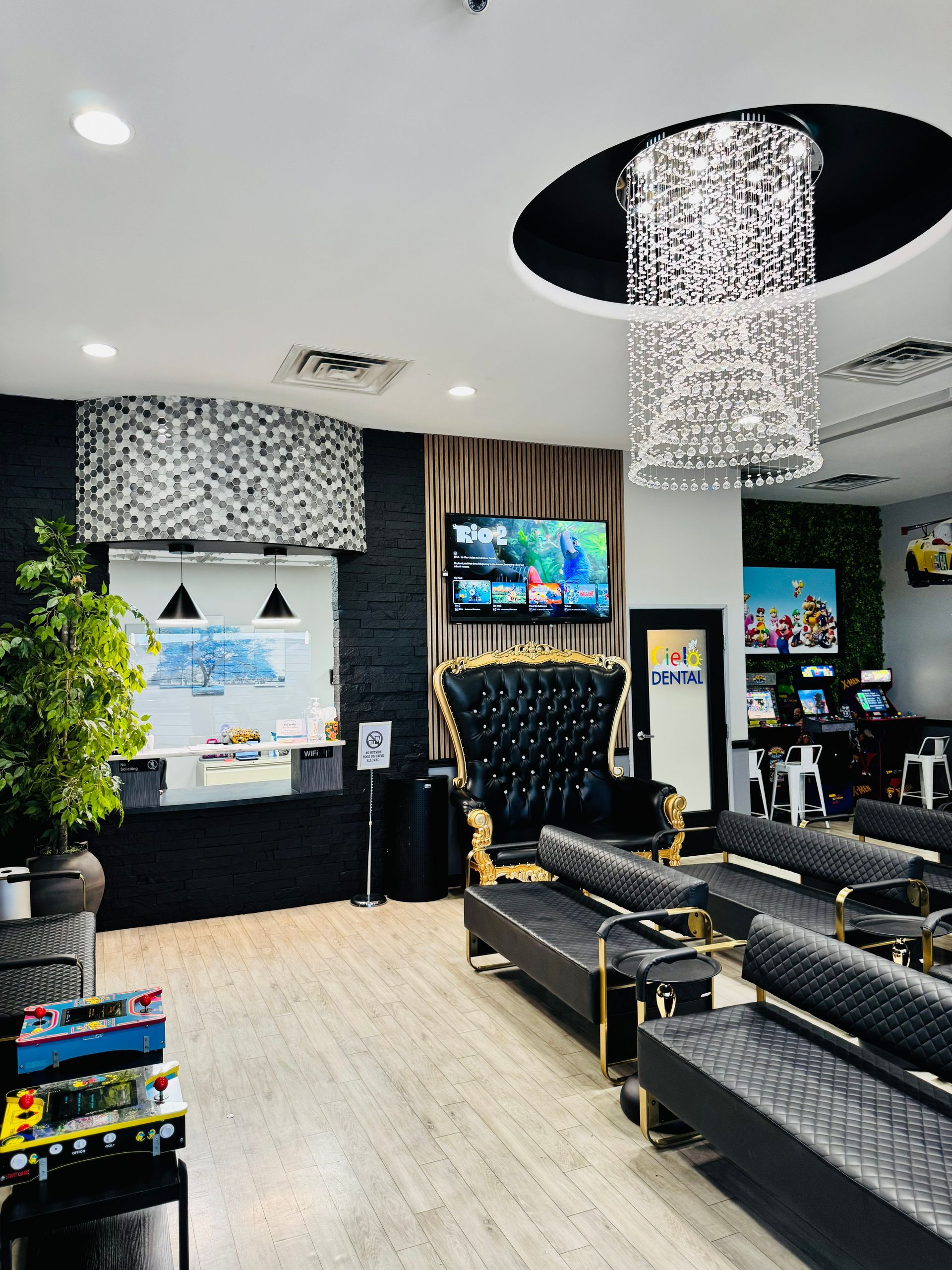 Cielo Dental, San Antonio. Lobby A movie theater with a cartoon character on the screen