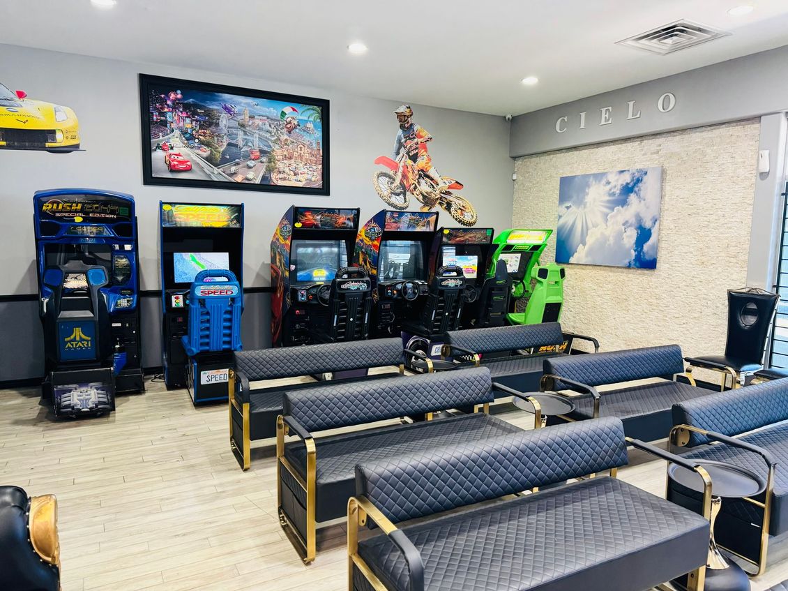 Cielo Dental, San Antonio. Lobby A room with a lot of televisions and chairs in it.