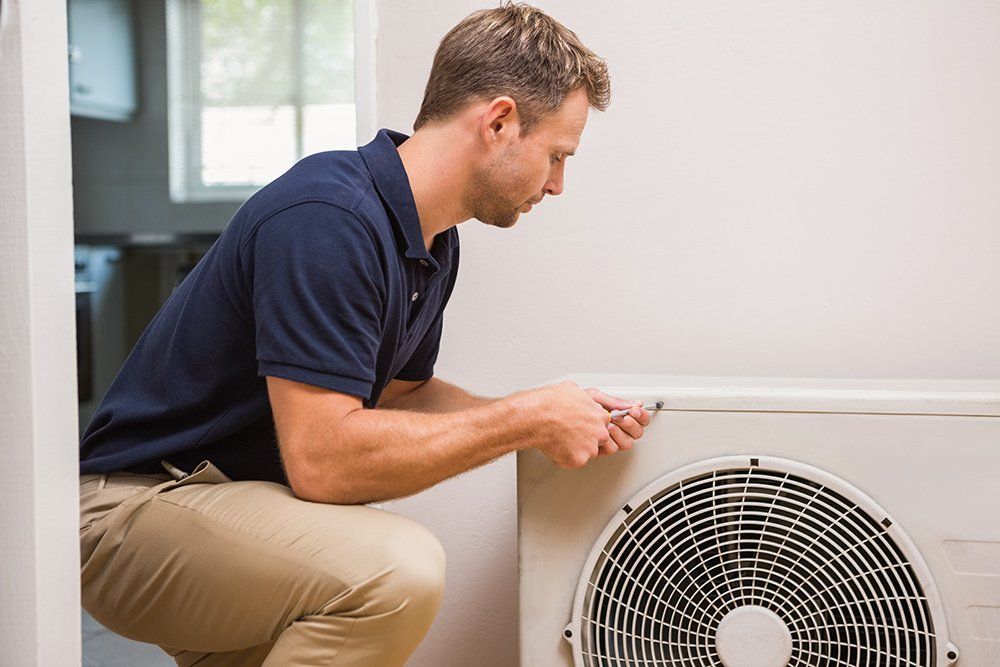 A Technician Repair an Indoor Air Conditioning Unit — Premiair Refrigeration, Air Conditioning & Electrical in Tamworth, NSW