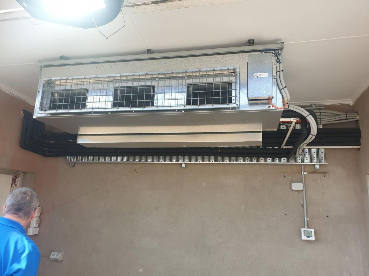 Ducted commercial air conditioning unit and electrical cabling installed in a Tamworth business