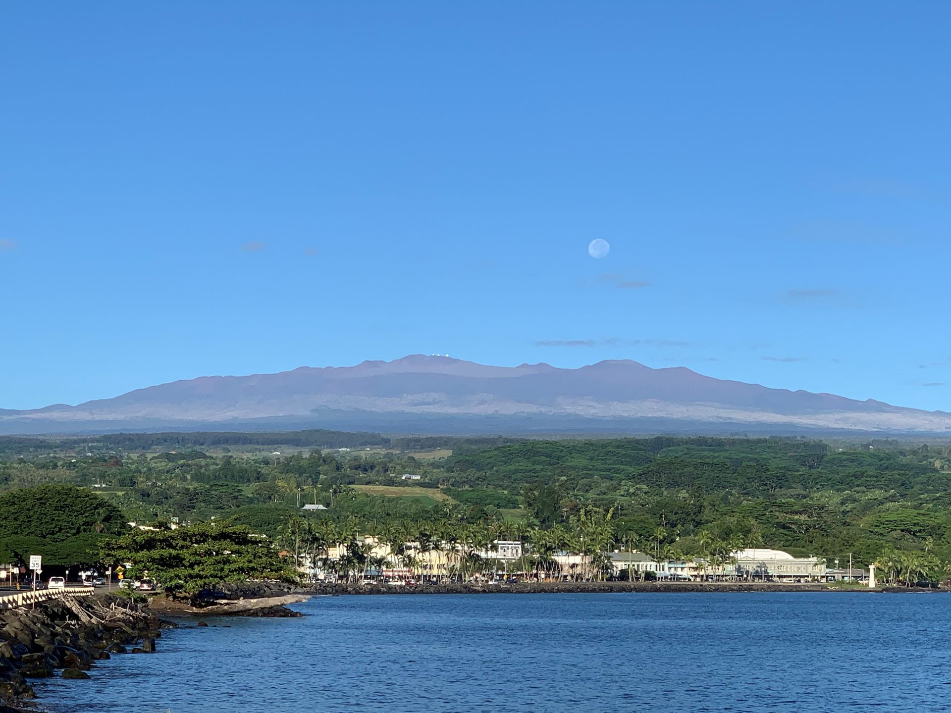 A view of a lake with a mountain in the background.