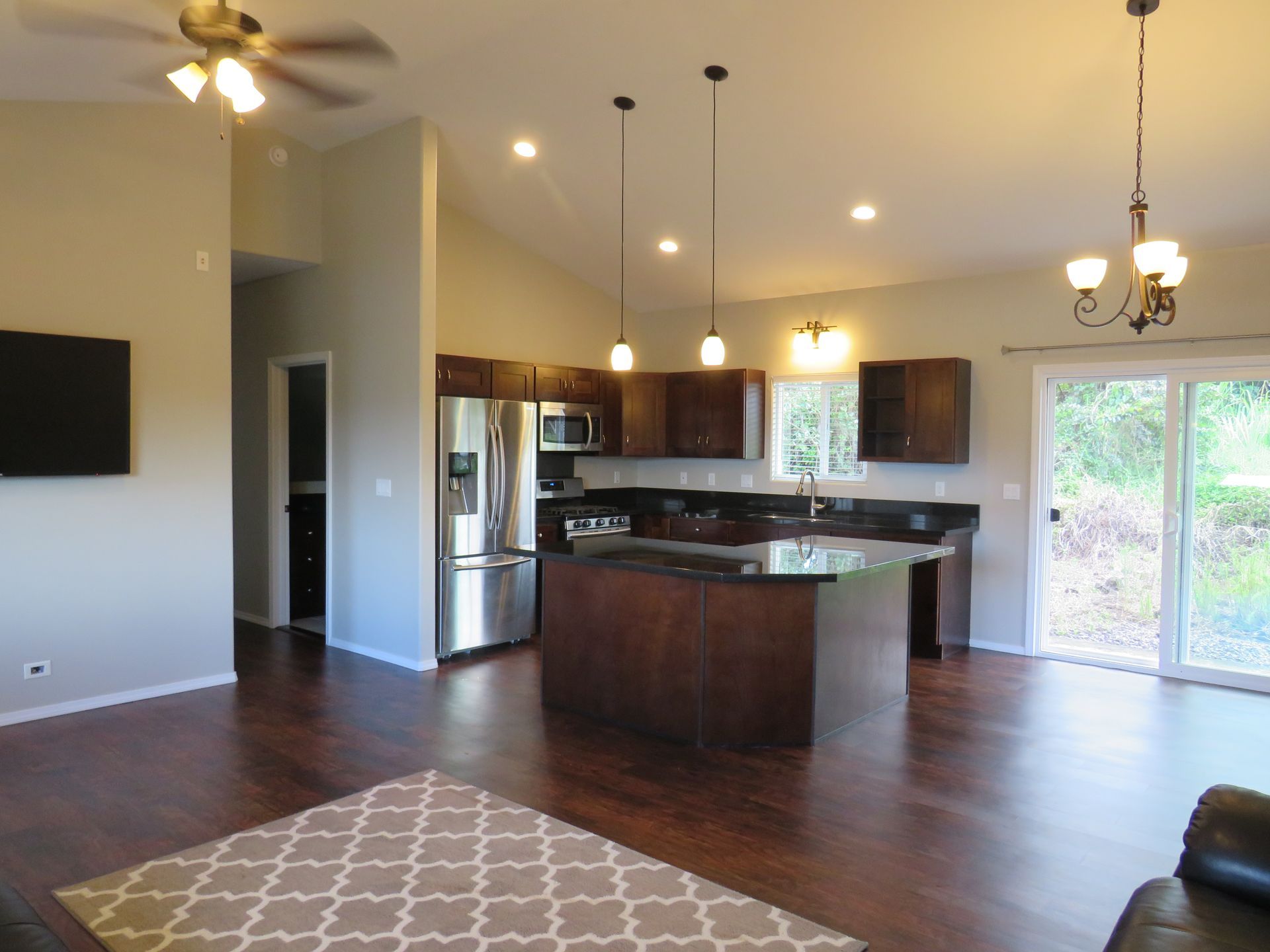 A kitchen with stainless steel appliances and a large island